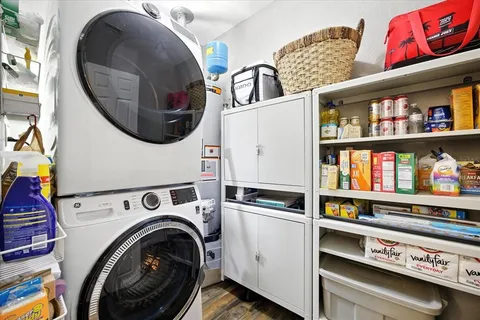 a kitchen with stainless steel appliances granite countertop a refrigerator stove microwave and sink