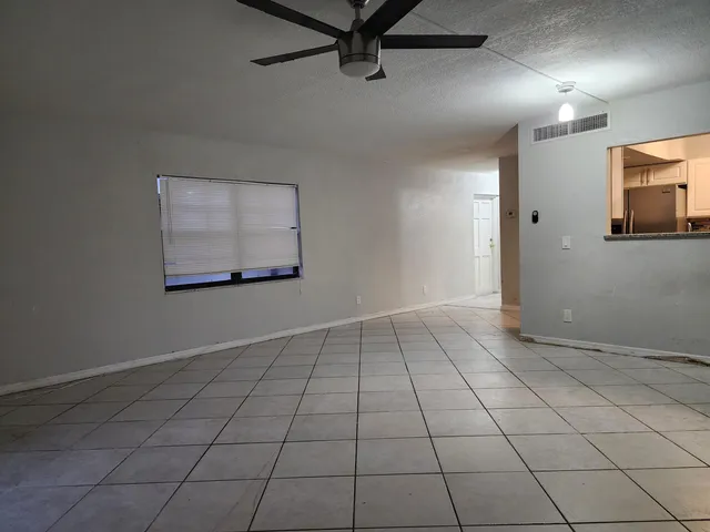 a view of an empty room and window