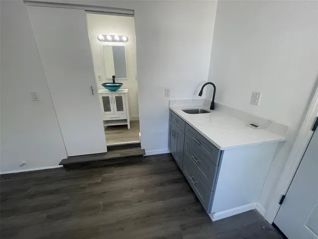 a front view of a house with a yard garage and trees