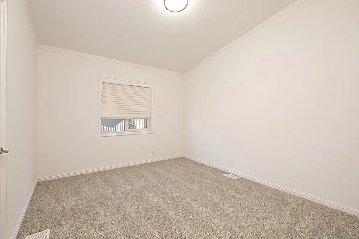 1120 East Mission Road, Unit 7 Fallbrook, CA 92028 - Photo 19 of 24 an empty room with a workbench