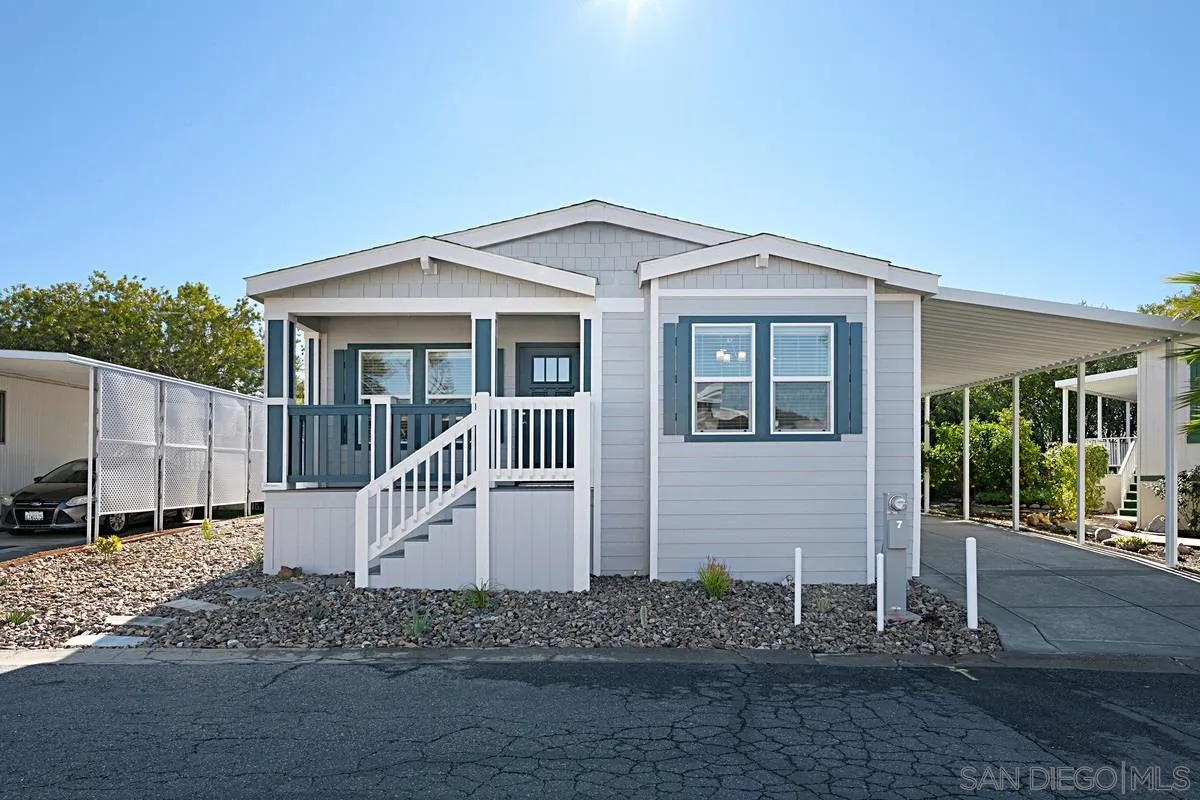 1120 East Mission Road, Unit 7 Fallbrook, CA 92028 - Photo 2 of 24 a front view of a house with a yard