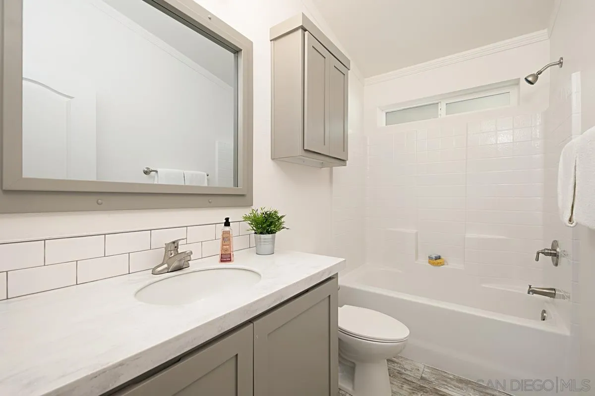 1120 East Mission Road, Unit 7 Fallbrook, CA 92028 - Photo 21 of 24 a bathroom with a sink a toilet and shower