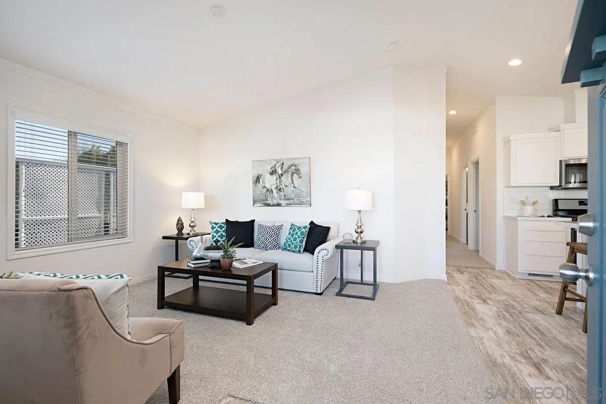1120 East Mission Road, Unit 7 Fallbrook, CA 92028 - Photo 5 of 24 a living room with furniture and a large window