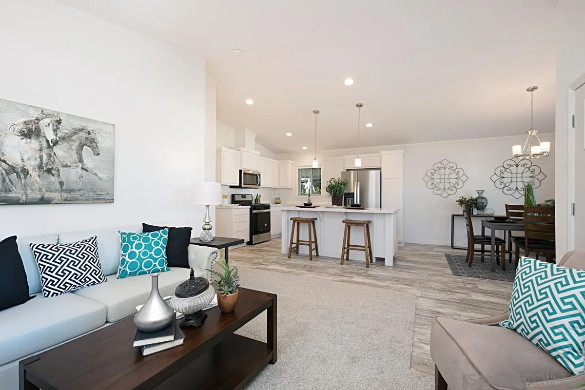 1120 East Mission Road, Unit 7 Fallbrook, CA 92028 - Photo 7 of 24 a living room with furniture and kitchen view