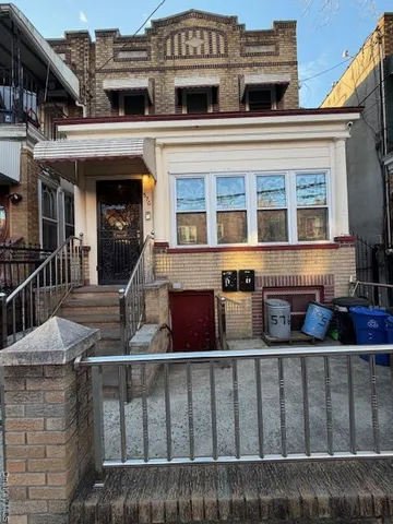 a view of a brick house with many windows