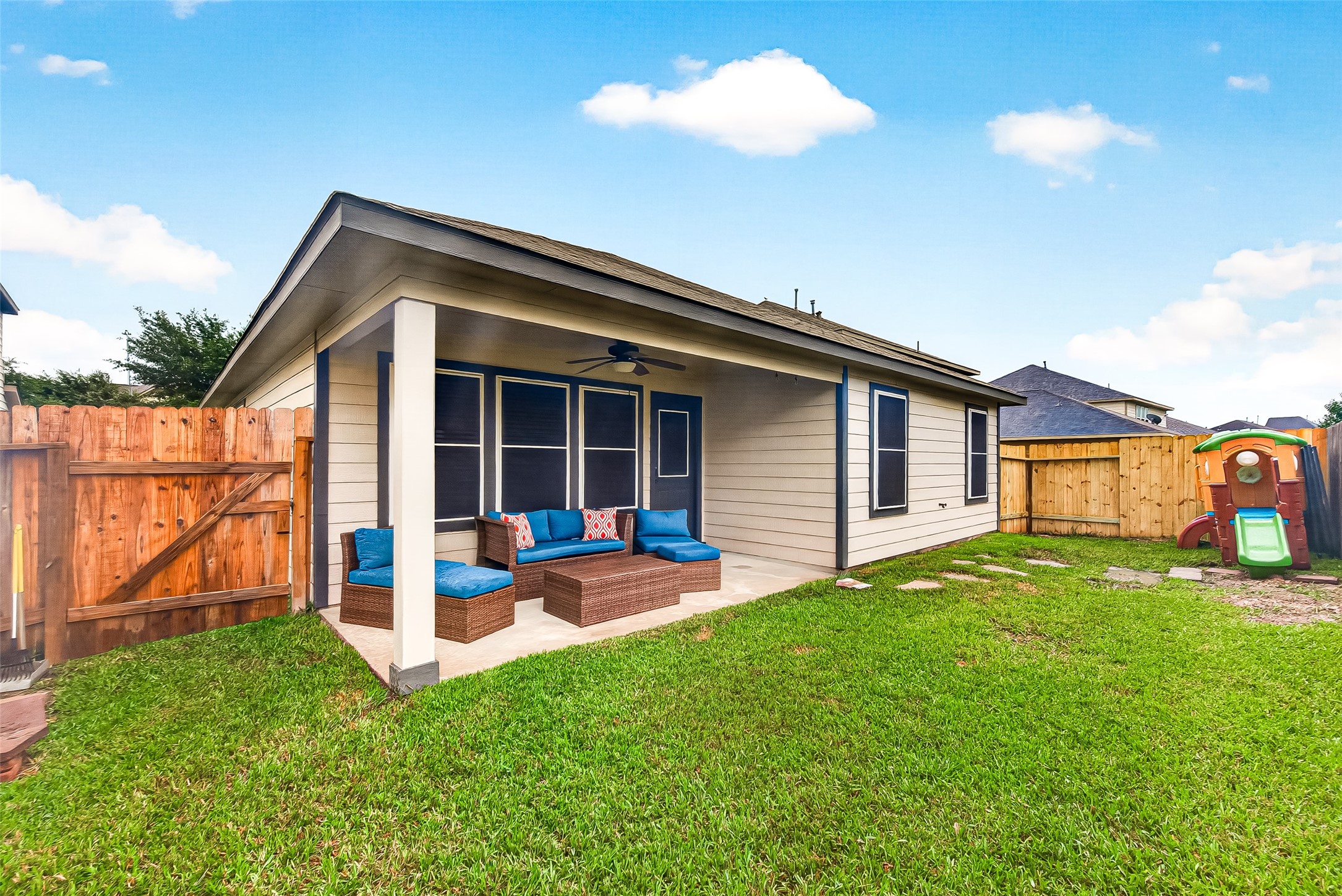 3155 View Valley Trail Katy, TX 77493 - Photo 47 of 50 Spacious, fully fenced backyard with a lovely green lawn—ideal for kids, pets, and weekend BBQs.