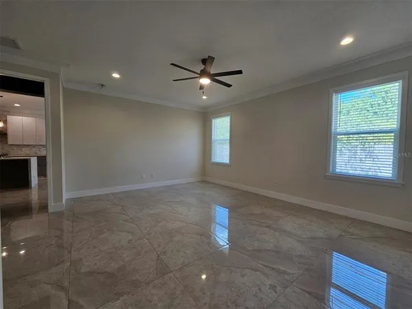 a view of an empty room with a window