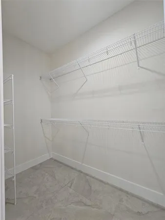 a view of a room with racks on the wall