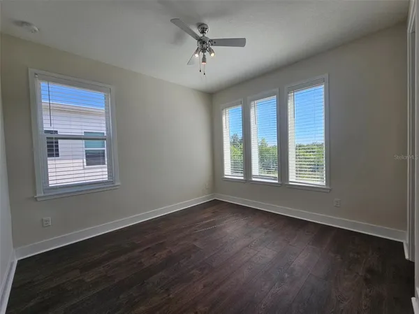 a view of room with window and hardwood floor