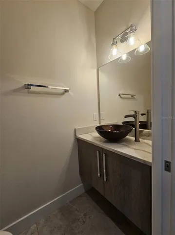 a bathroom with a sink a vanity and a mirror