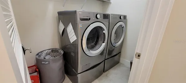 a utility room with dryer and washer