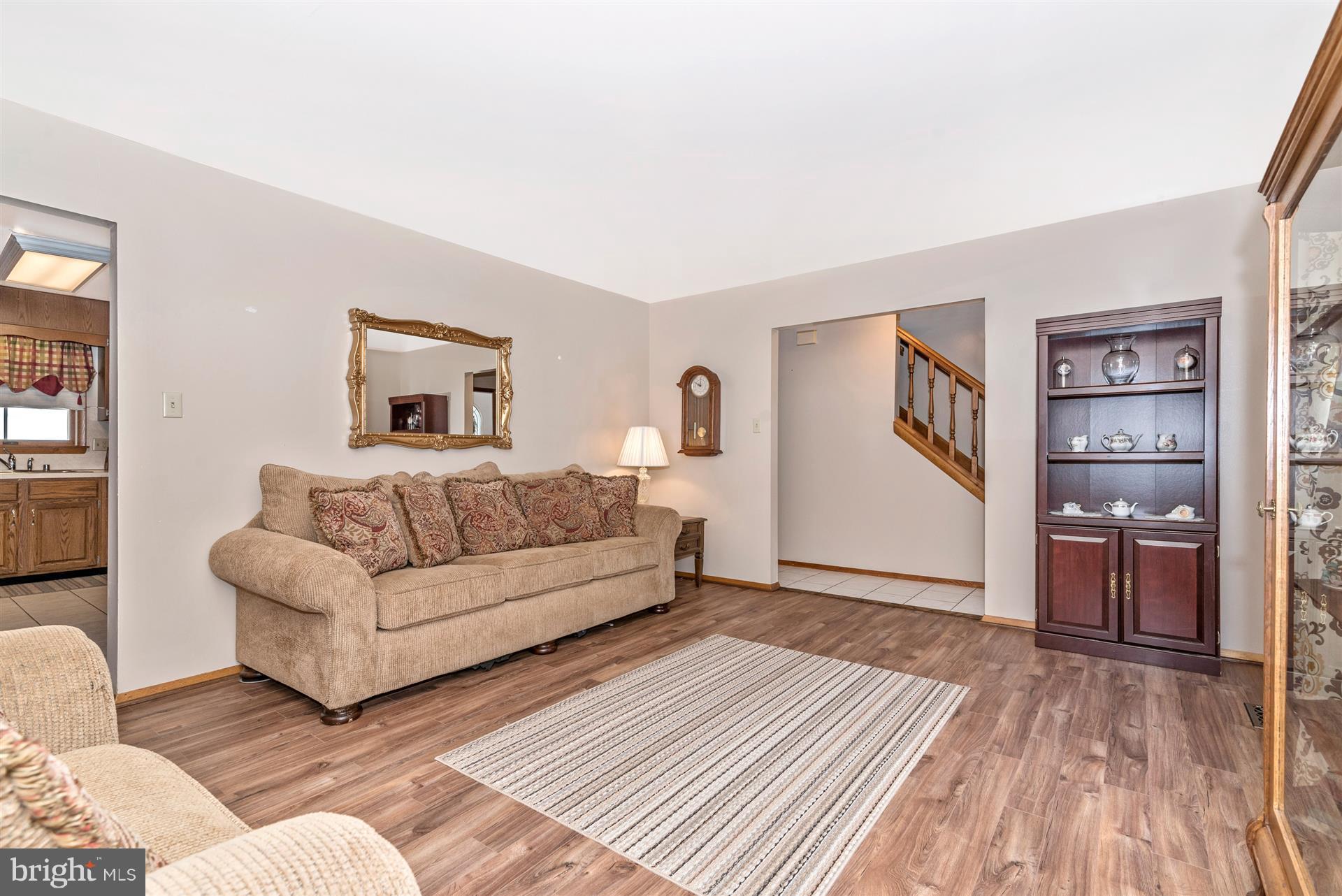 8717 Indian Springs Road Frederick, MD 21702 - Photo 13 of 24 a living room with furniture and a wooden floor