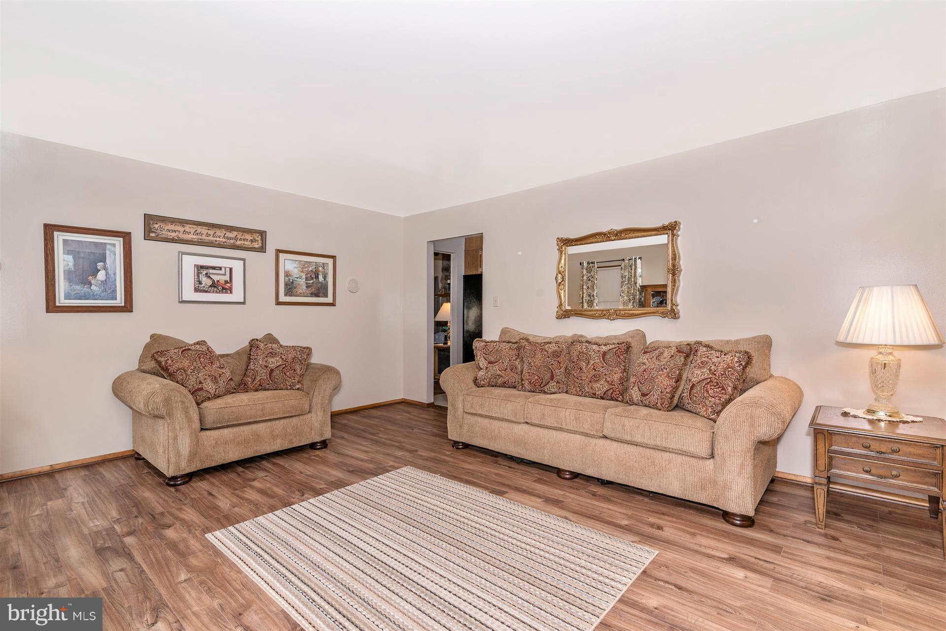 8717 Indian Springs Road Frederick, MD 21702 - Photo 14 of 24 a living room with furniture and a wooden floor