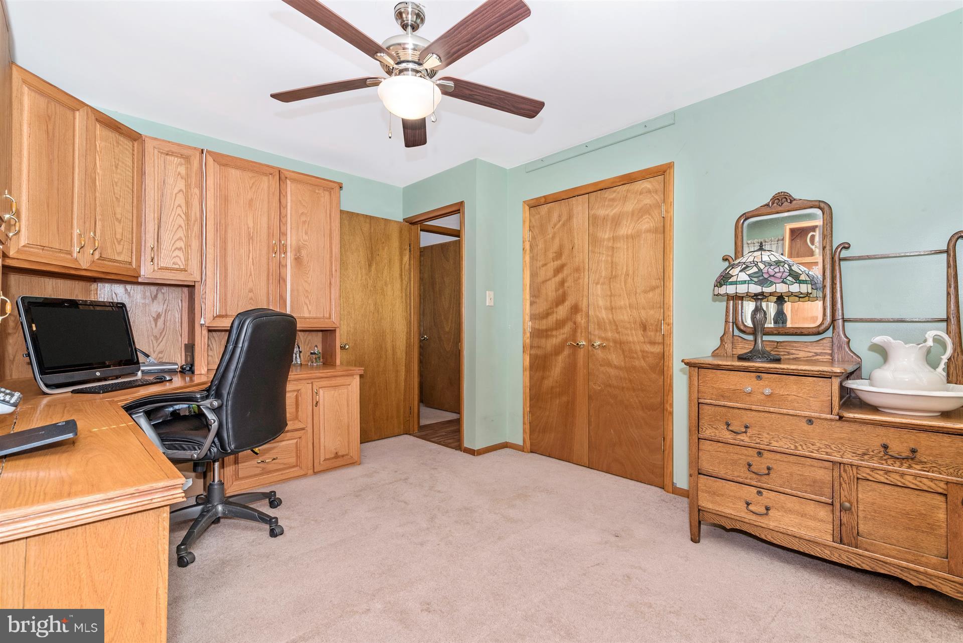 8717 Indian Springs Road Frederick, MD 21702 - Photo 24 of 24 a view of a workspace with furniture and a window