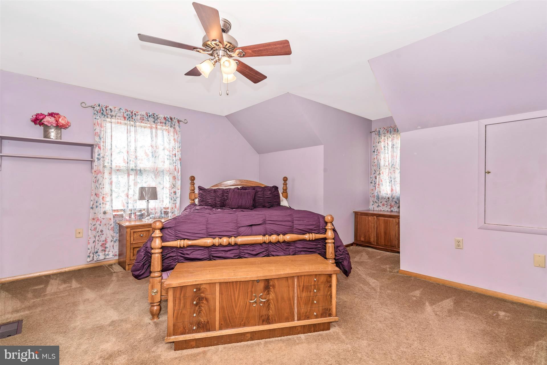 8717 Indian Springs Road Frederick, MD 21702 - Photo 4 of 24 a bed room with a bed and a window