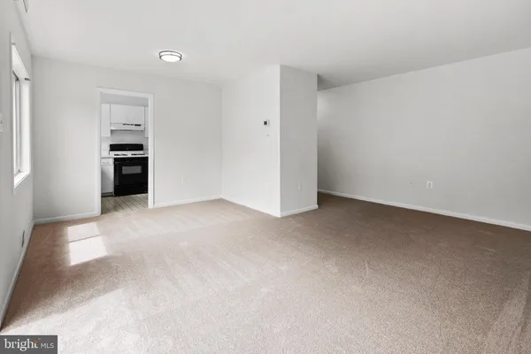 a kitchen with a stove and a refrigerator