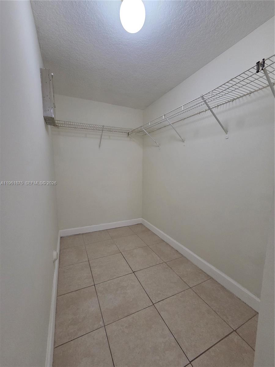 1251 Southeast 29th Street, Unit 10326 Homestead, FL 33035 - Photo 12 of 17 a view of a room with racks on the wall