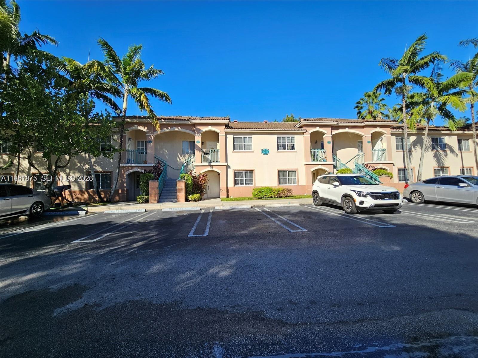 1251 Southeast 29th Street, Unit 10326 Homestead, FL 33035 - Photo 17 of 17 a front view of a house with a yard
