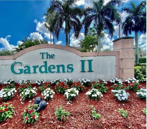 a sign that is in front of flowers