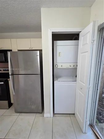 a utility room with cabinets