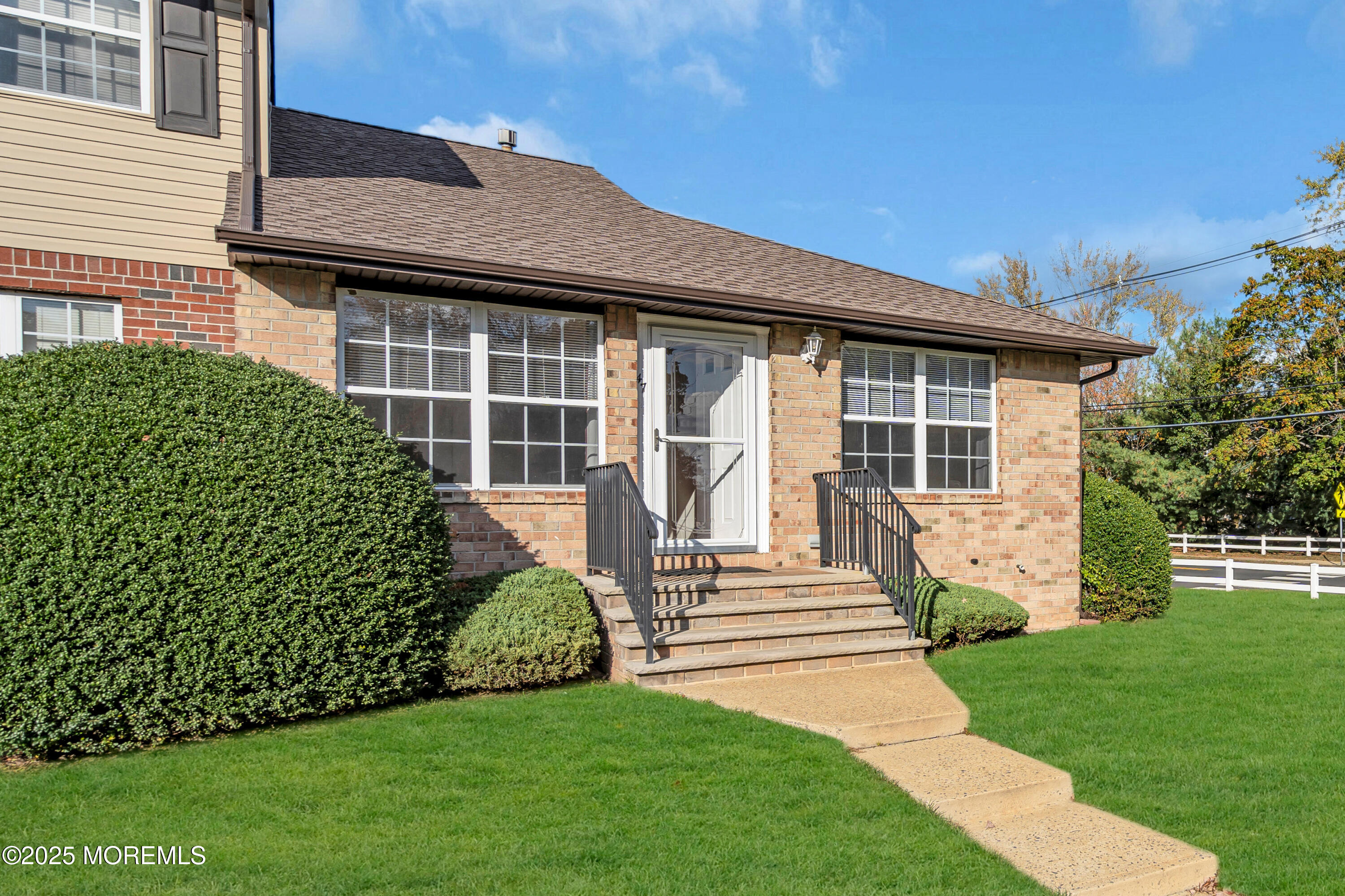 47 Kitty Court Brick, NJ 08724 - Photo 2 of 17 a front view of a house with a garden