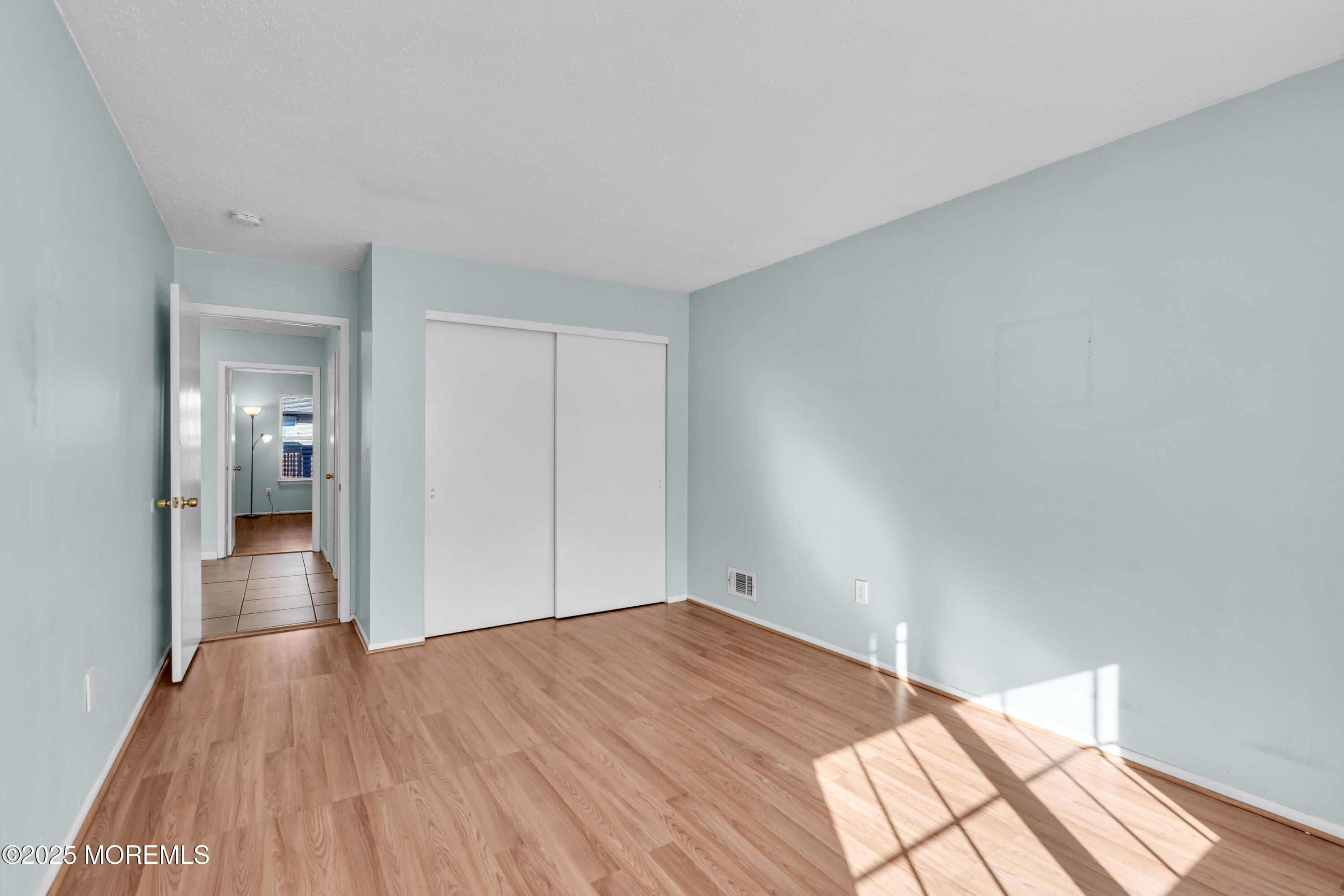 47 Kitty Court Brick, NJ 08724 - Photo 5 of 17 a view of empty room with wooden floor