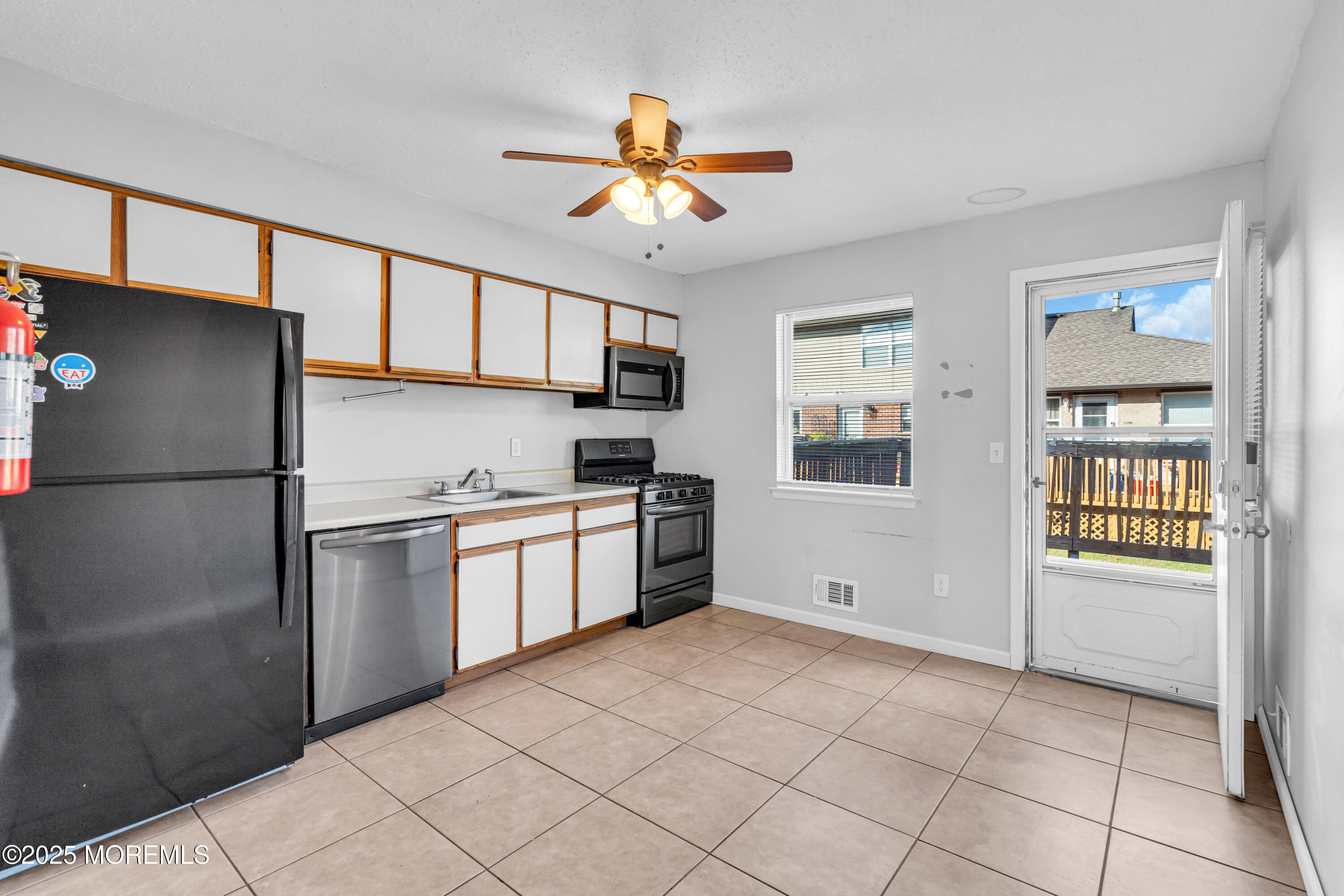 47 Kitty Court Brick, NJ 08724 - Photo 9 of 17 a kitchen with stainless steel appliances granite countertop a refrigerator and a sink