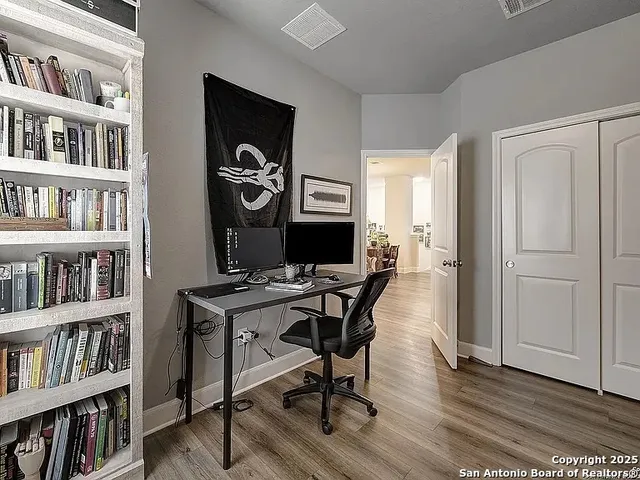a view of a workspace with bookshelf