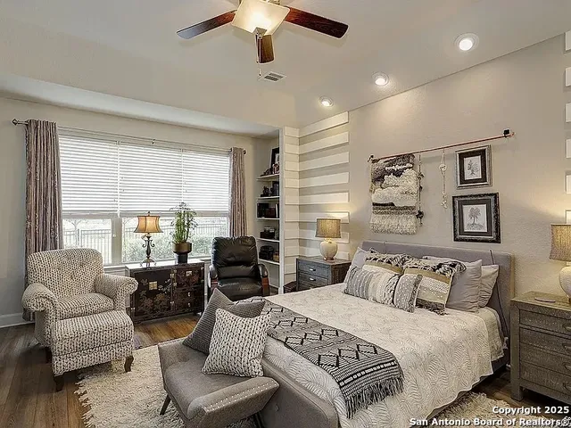 a bedroom with a large bed and a couch