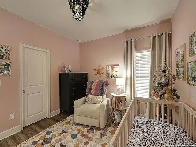 a bedroom with furniture and a window