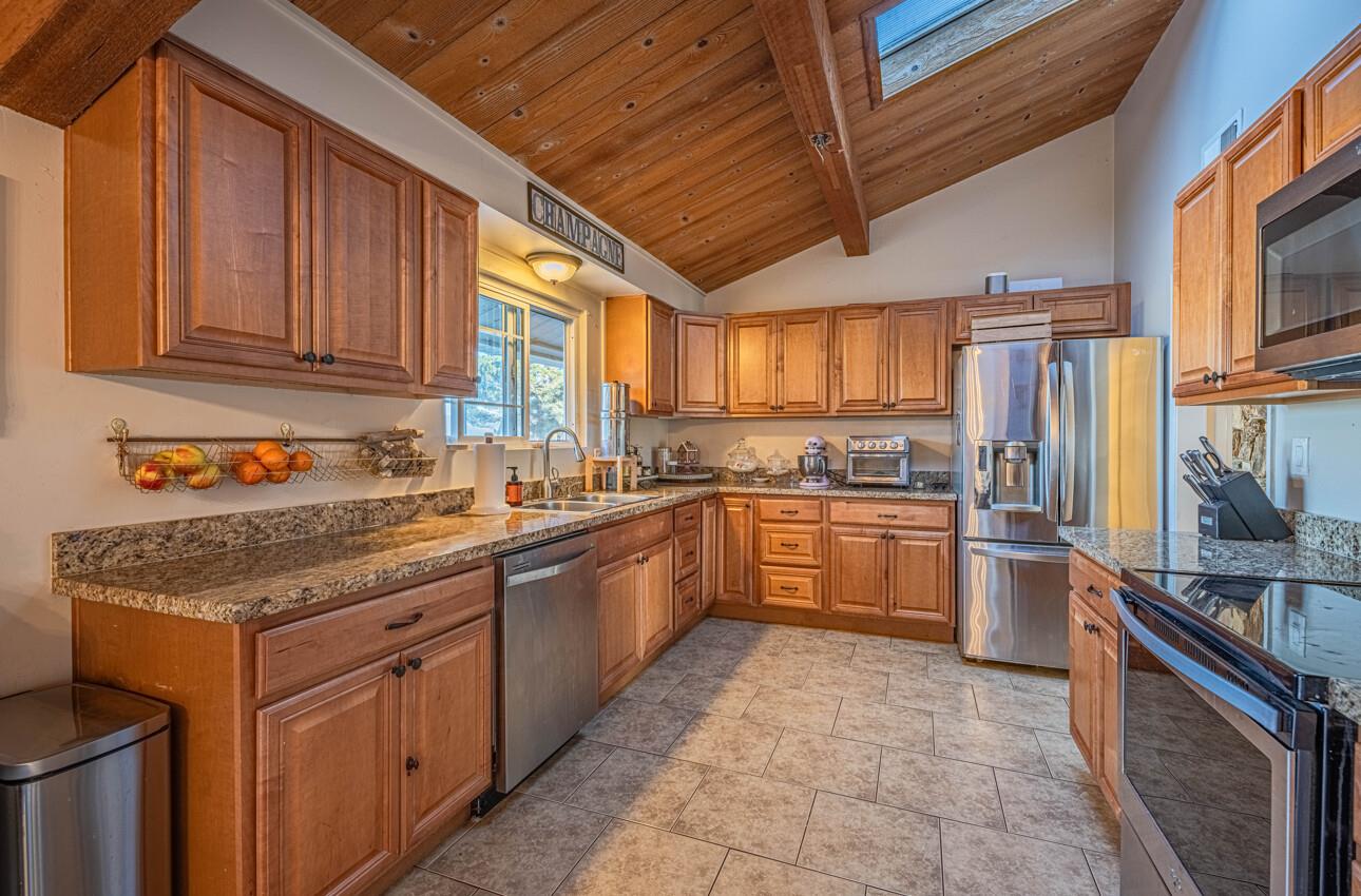 844 River Road Salinas, CA 93908 - Photo 32 of 77 a kitchen with stainless steel appliances granite countertop a stove sink and cabinets