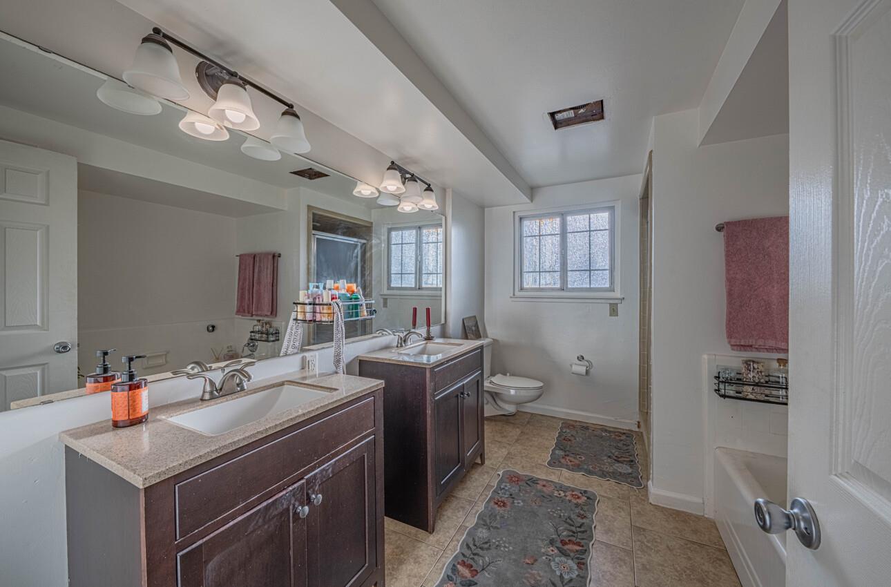 844 River Road Salinas, CA 93908 - Photo 47 of 77 a view of a bathroom with a sink a toilet and a mirror