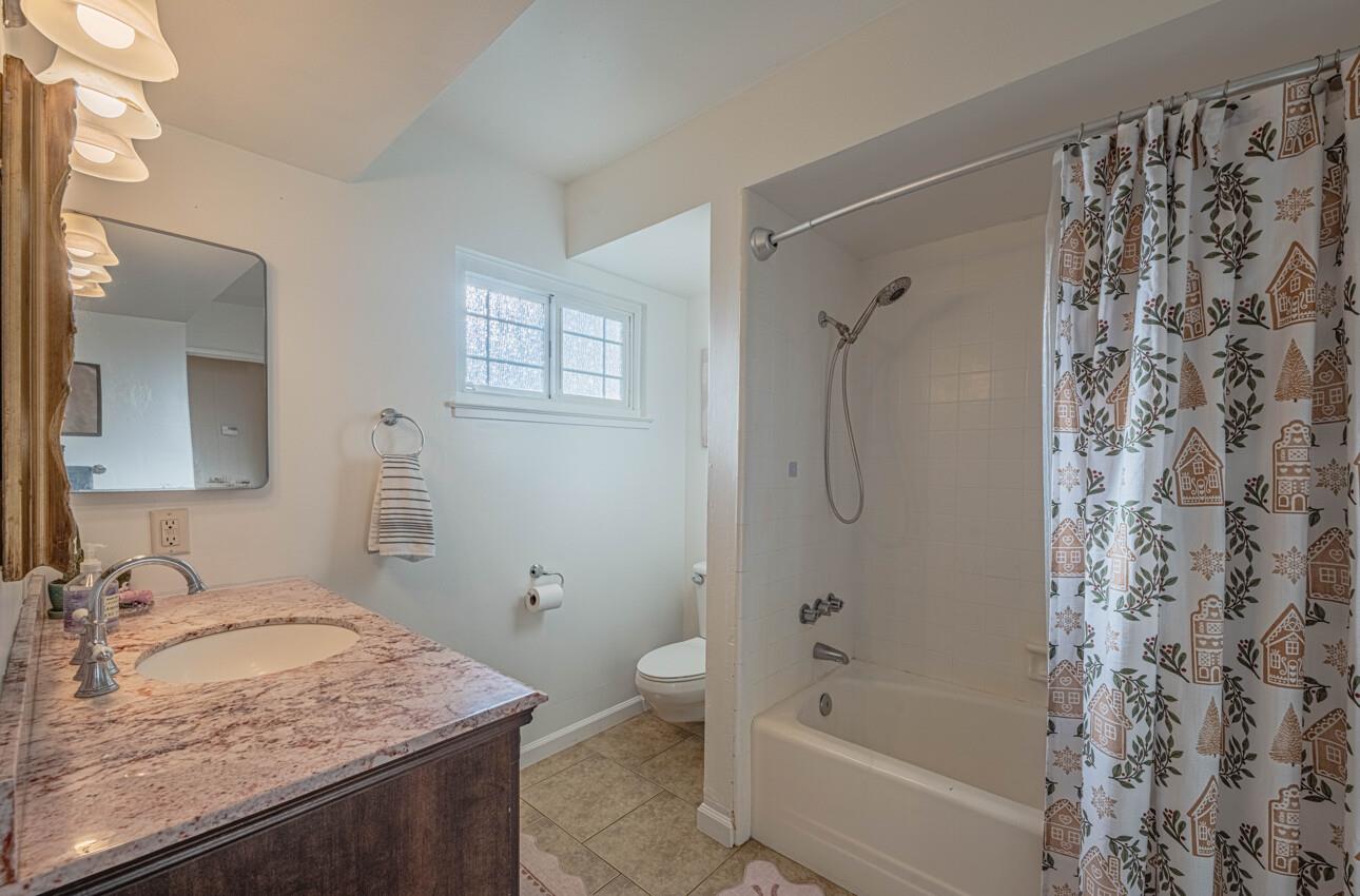 844 River Road Salinas, CA 93908 - Photo 52 of 77 a bathroom with a granite countertop sink a toilet and shower
