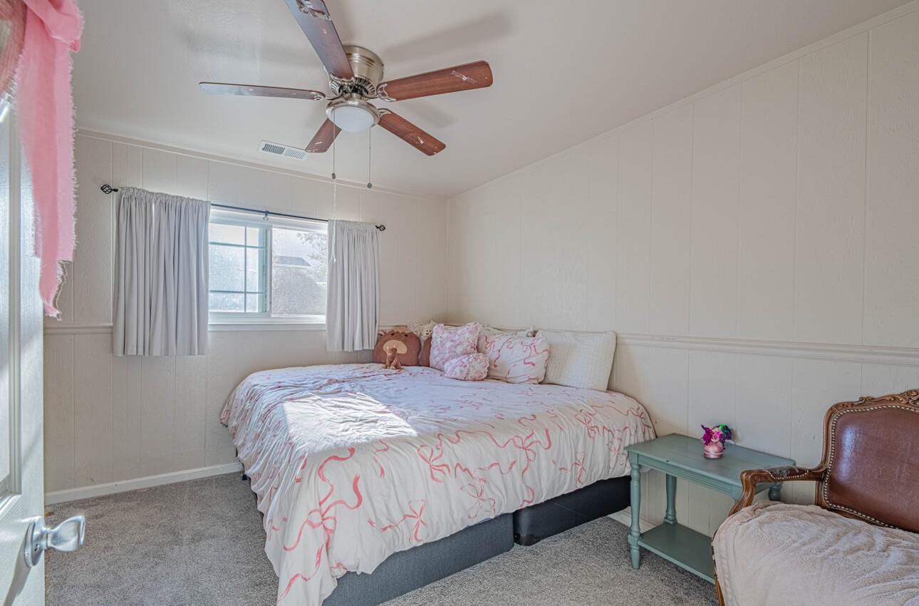844 River Road Salinas, CA 93908 - Photo 53 of 77 a bedroom with a bed couch and window