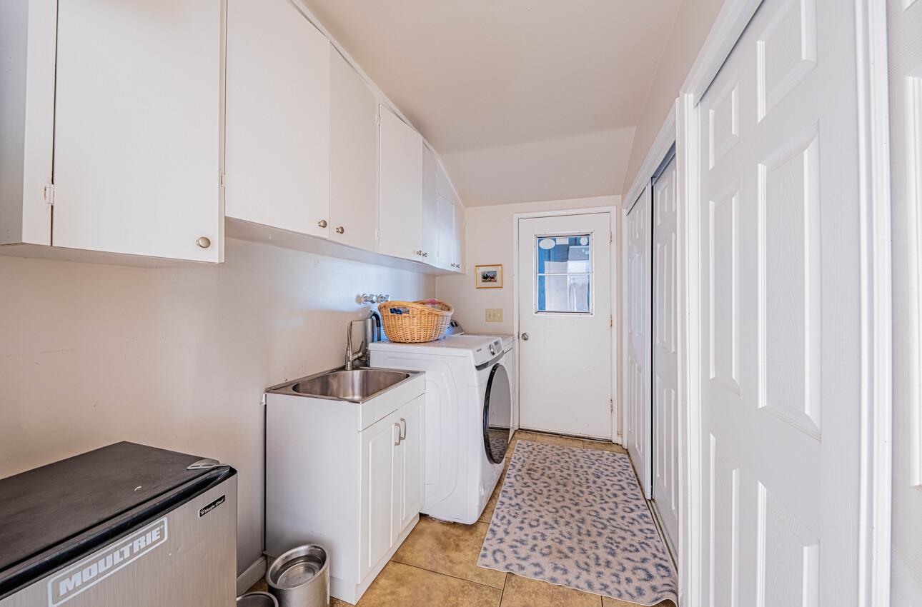 844 River Road Salinas, CA 93908 - Photo 55 of 77 a storage room with wooden floor washer and dryer