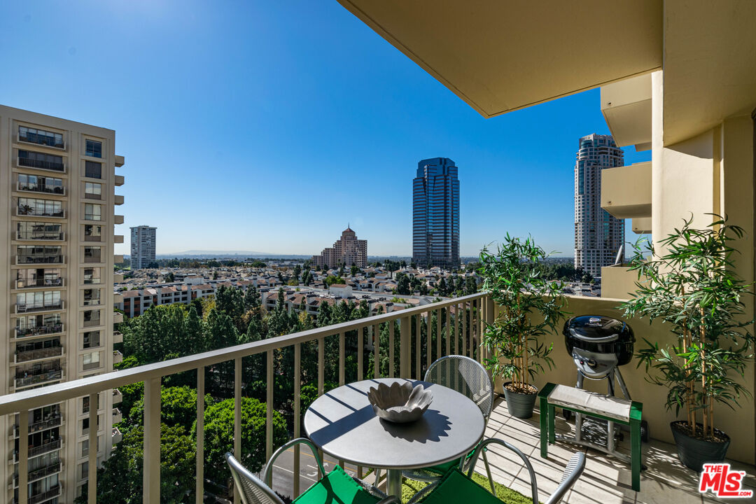 2160 Century Park East, Unit 1607 Los Angeles, CA 90067 - Photo 1 of 38 a balcony with furniture and a potted plant