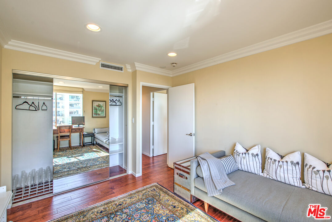 2160 Century Park East, Unit 1607 Los Angeles, CA 90067 - Photo 11 of 38 a living room with furniture and a rug