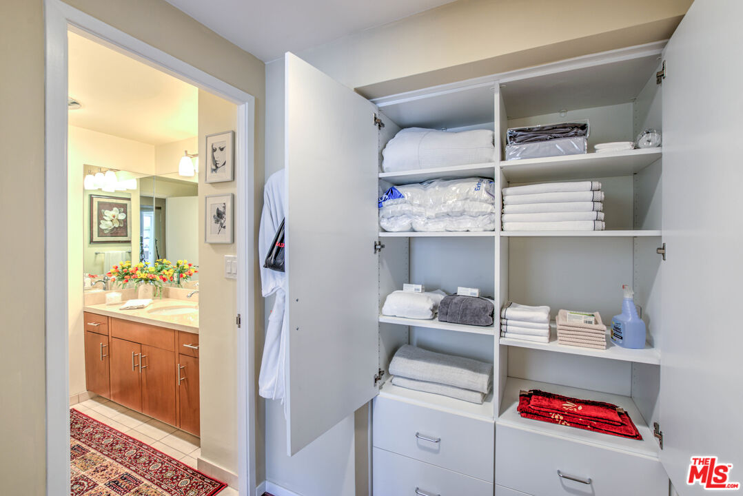 2160 Century Park East, Unit 1607 Los Angeles, CA 90067 - Photo 12 of 38 a room with a walk in closet and wooden floor
