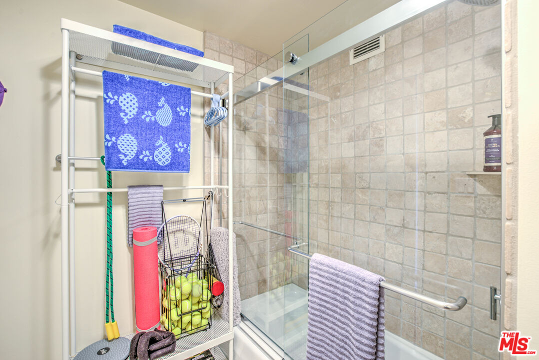 2160 Century Park East, Unit 1607 Los Angeles, CA 90067 - Photo 14 of 38 a bathroom with a bathtub and shower