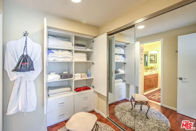 a bathroom with a sink vanity and a mirror