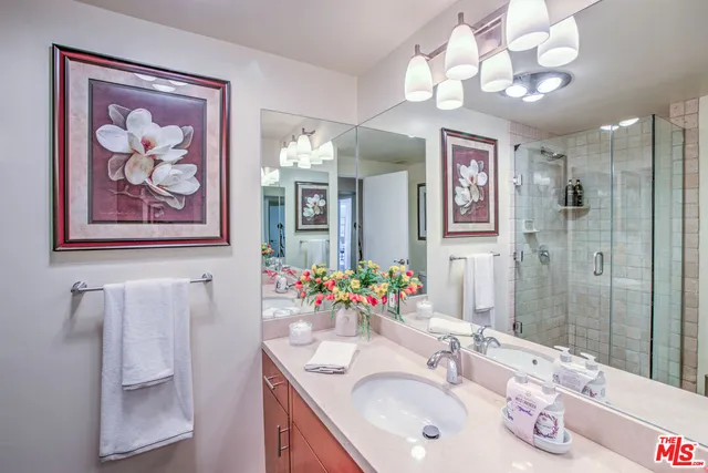 a bathroom with a picture bed and a shower