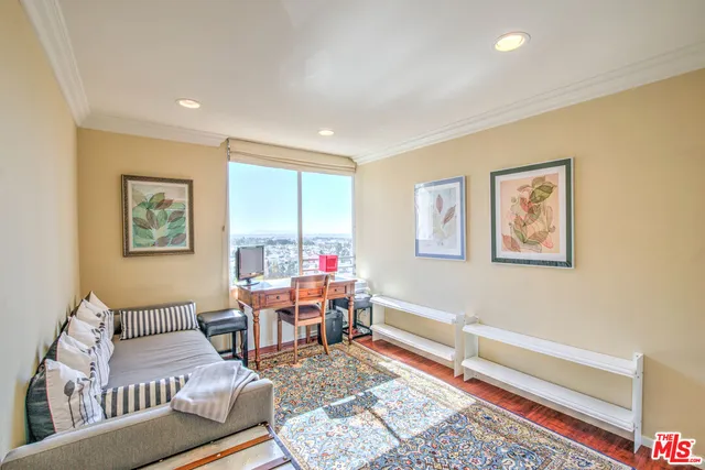 a living room with furniture and a rug