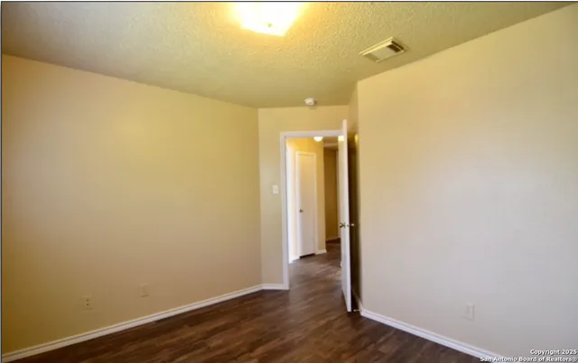 a view of a bathroom with wooden floor