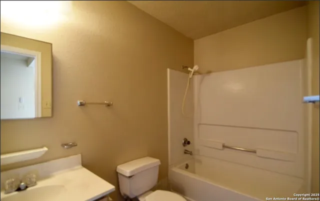 a bathroom with a toilet and a bathtub