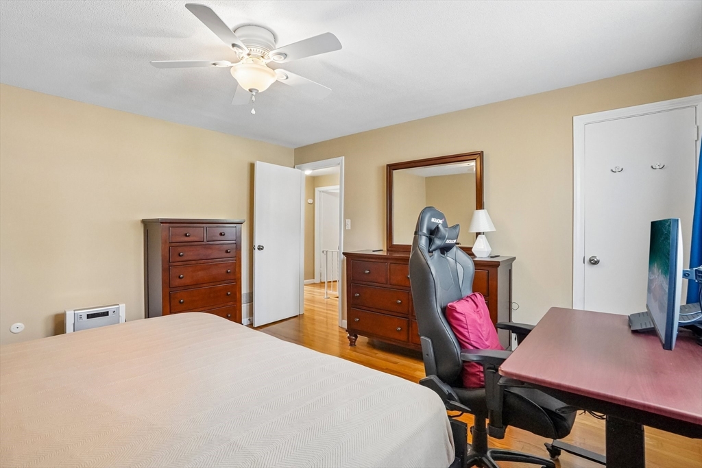 35 Westgate Road Framingham, MA 01701 - Photo 24 of 37 a bedroom with a bed a desk and chair
