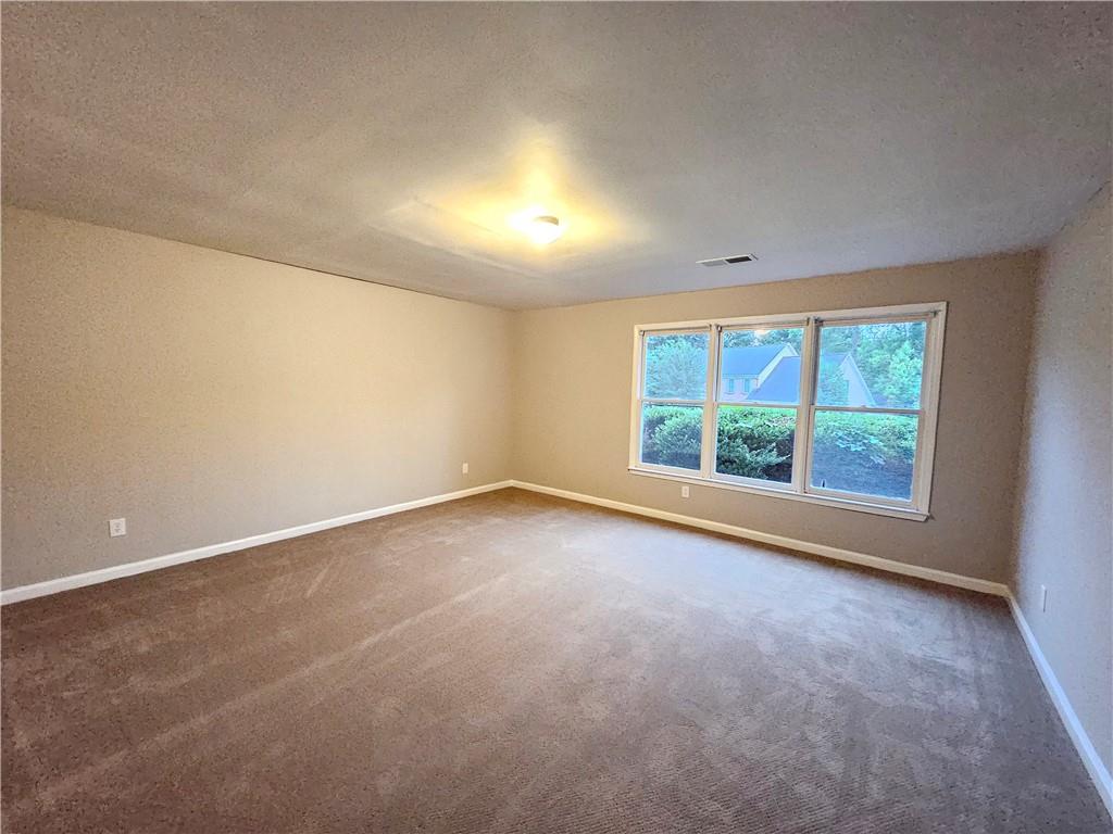 144 Hunters Trace Dallas, GA 30157 - Photo 14 of 34 an empty room with a window