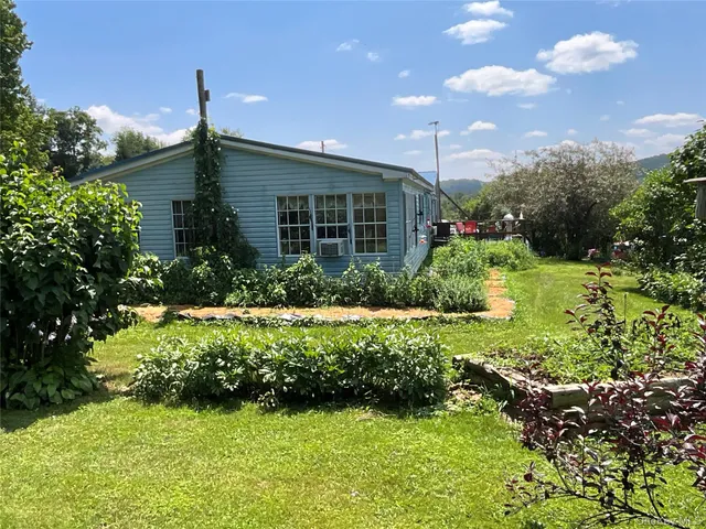 a house view with a garden space