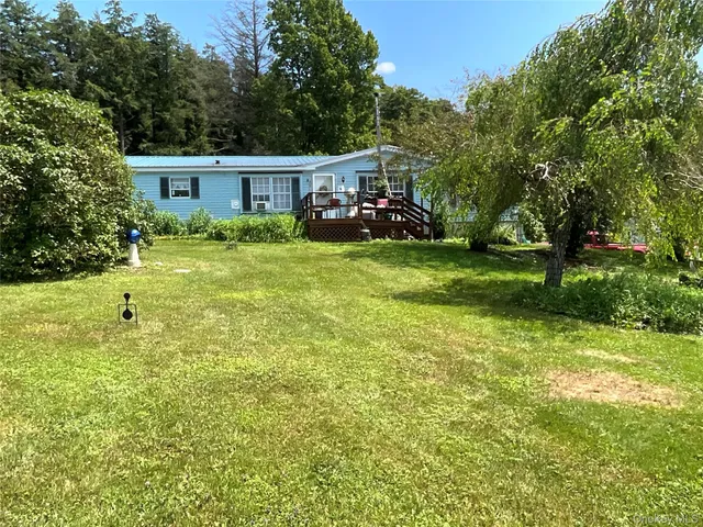 a view of swimming pool with a garden