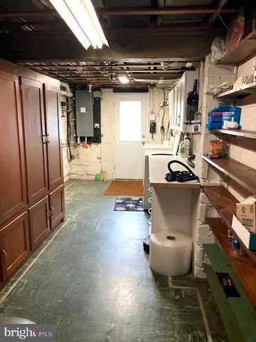 a view of a room with wooden shelves