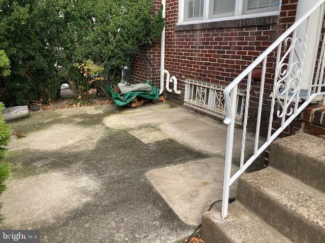 a view of entryway with wooden stairs